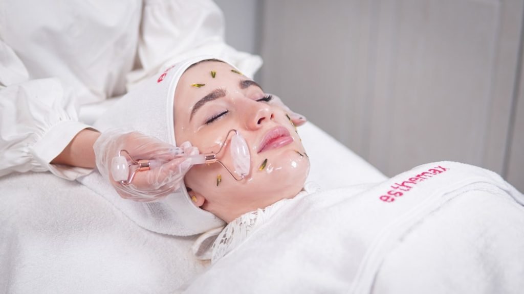 a-woman-getting-a-facial-mask-on-her-face-qj1myraktlg